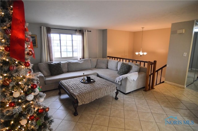 tiled living room featuring a chandelier