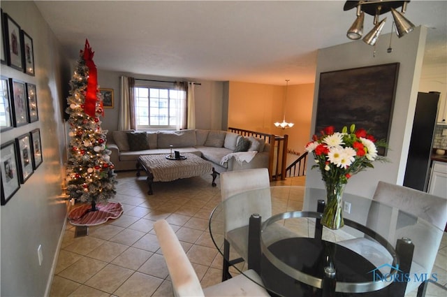 living room featuring a chandelier and light tile patterned floors