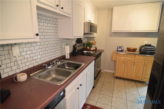 kitchen featuring white cabinets, light tile patterned floors, sink, and appliances with stainless steel finishes