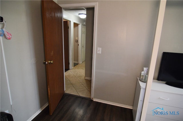 hall with hardwood / wood-style floors