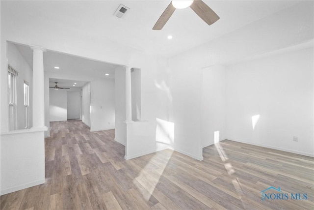 empty room with ceiling fan and light wood-type flooring