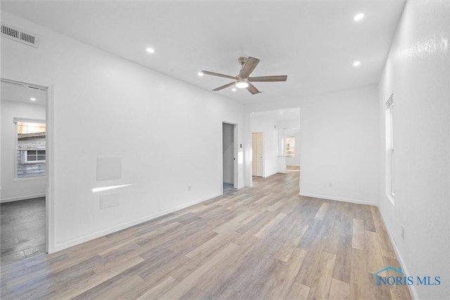 unfurnished room featuring ceiling fan and light hardwood / wood-style flooring