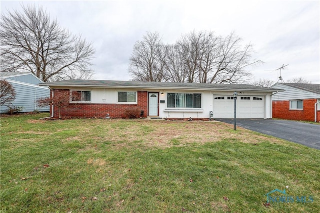 ranch-style house with a front lawn and a garage