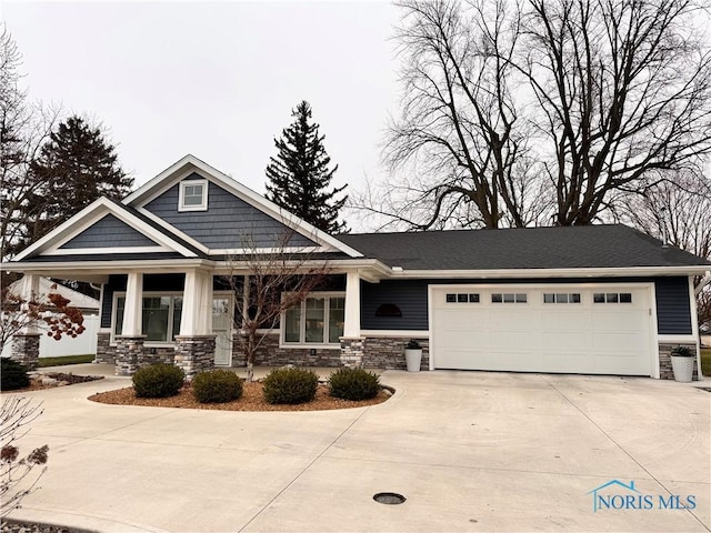 craftsman inspired home with a garage