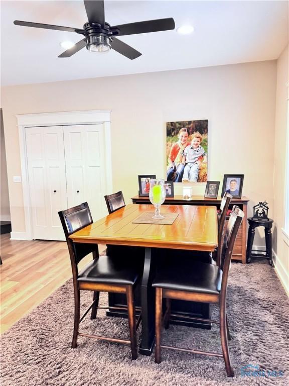 dining room featuring hardwood / wood-style floors and ceiling fan