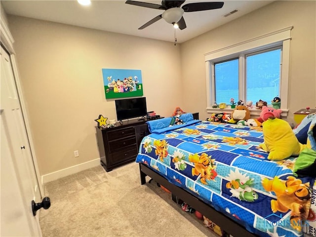 bedroom with light carpet and ceiling fan