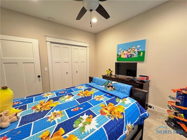 bedroom with carpet, ceiling fan, and a closet