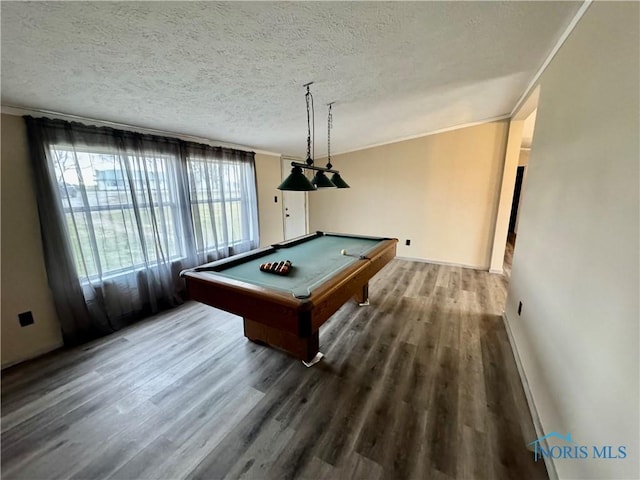 rec room featuring hardwood / wood-style floors, a textured ceiling, crown molding, and billiards