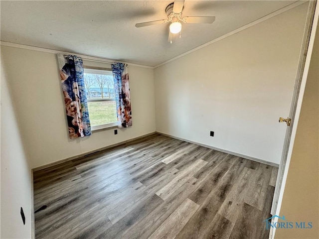 unfurnished bedroom with hardwood / wood-style flooring, ceiling fan, and crown molding