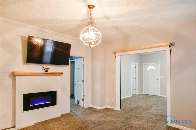 unfurnished living room featuring crown molding, carpet, a textured ceiling, and a notable chandelier