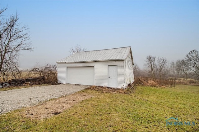 garage with a yard