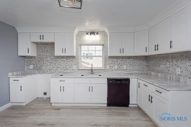 kitchen featuring sink, white cabinets, and black dishwasher