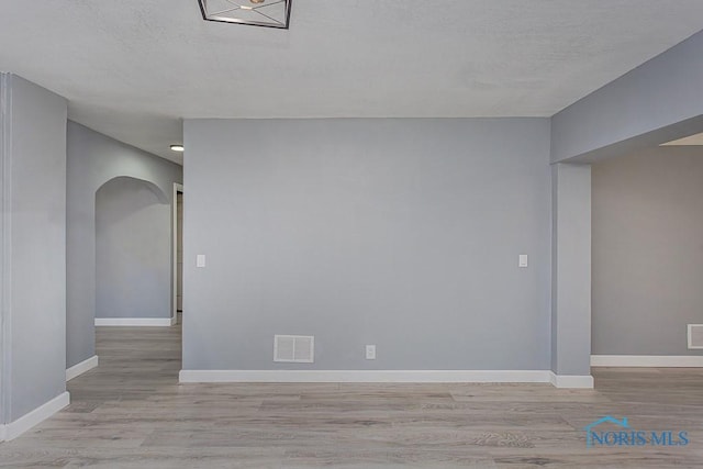 spare room featuring light hardwood / wood-style flooring