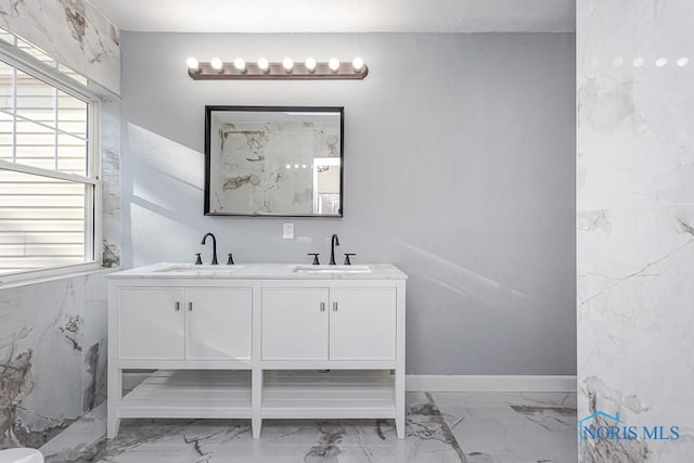 bathroom with a wealth of natural light and vanity