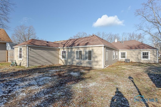 rear view of property featuring central AC unit