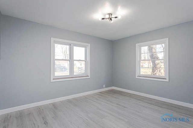 unfurnished room with plenty of natural light and light wood-type flooring