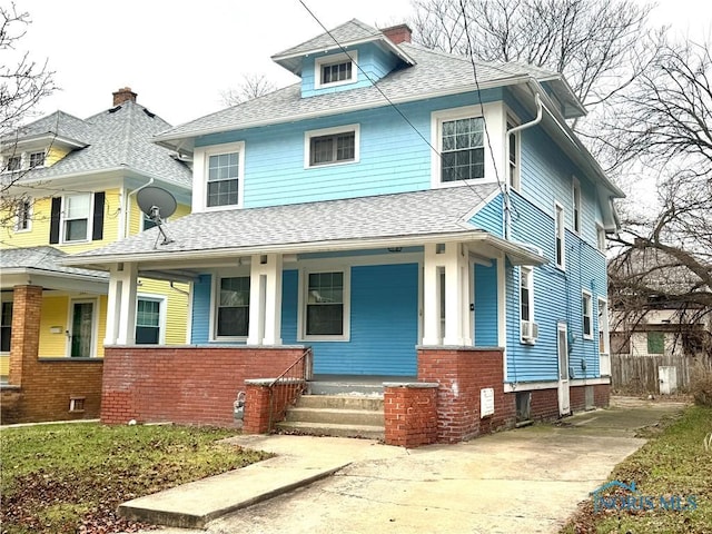 view of front facade with cooling unit and covered porch