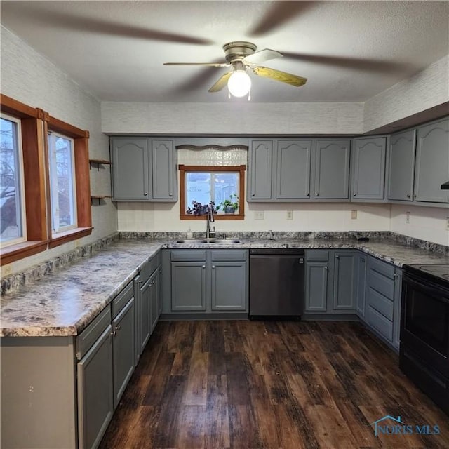 kitchen featuring electric range, stainless steel dishwasher, gray cabinetry, and sink