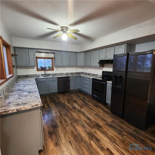 kitchen featuring gray cabinetry, ceiling fan, dark wood-type flooring, sink, and black appliances