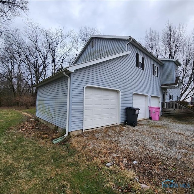 view of side of home featuring a garage