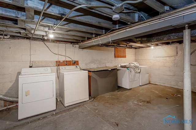 basement featuring washing machine and dryer