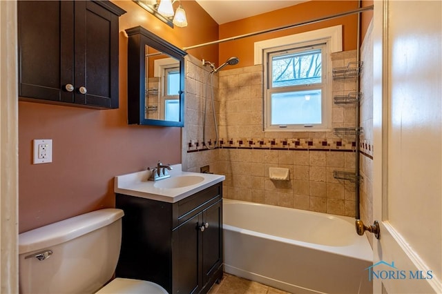 full bathroom with vanity, toilet, and tiled shower / bath