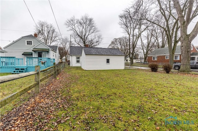 view of yard with an outbuilding and a deck