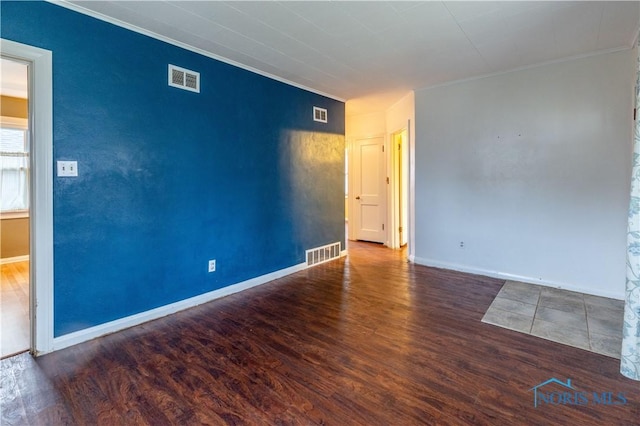 unfurnished room with dark hardwood / wood-style floors and ornamental molding