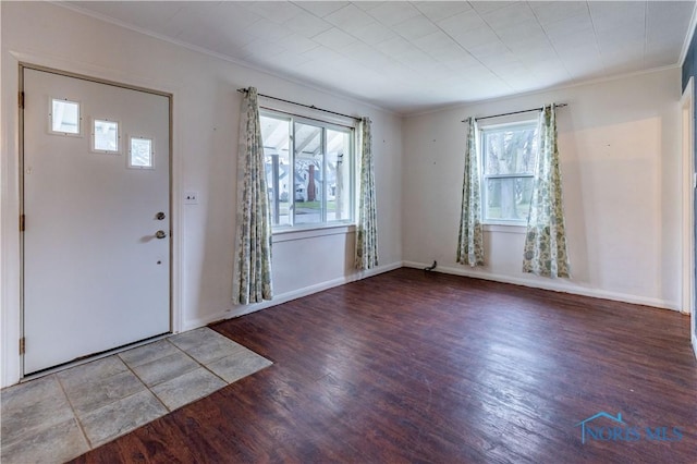 entryway featuring hardwood / wood-style floors, a wealth of natural light, and ornamental molding