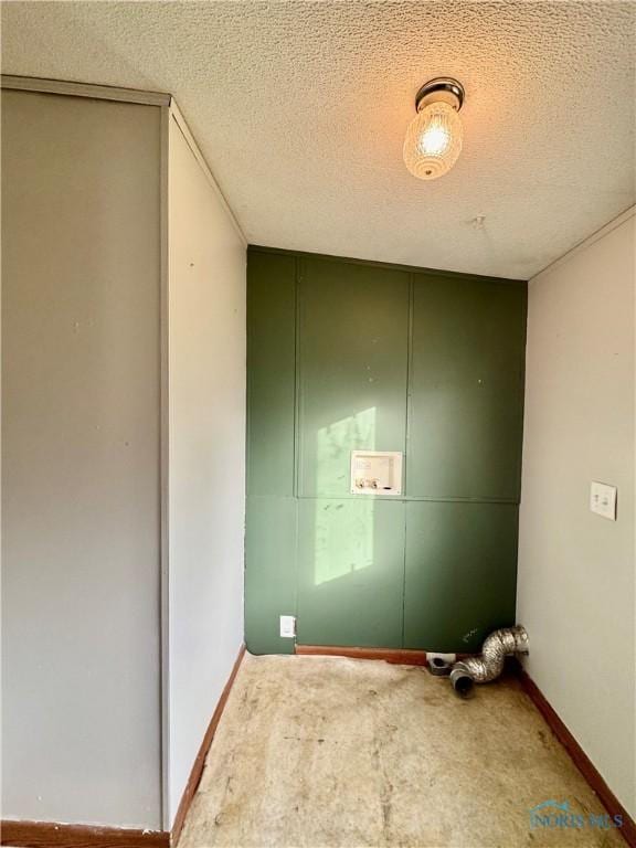 laundry area with washer hookup, carpet floors, and a textured ceiling