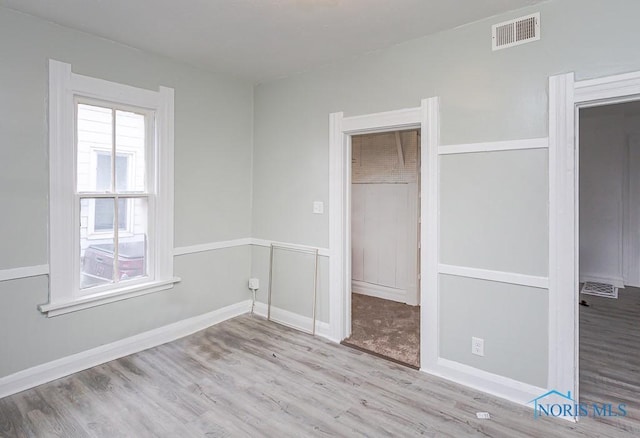 unfurnished bedroom featuring light wood-type flooring