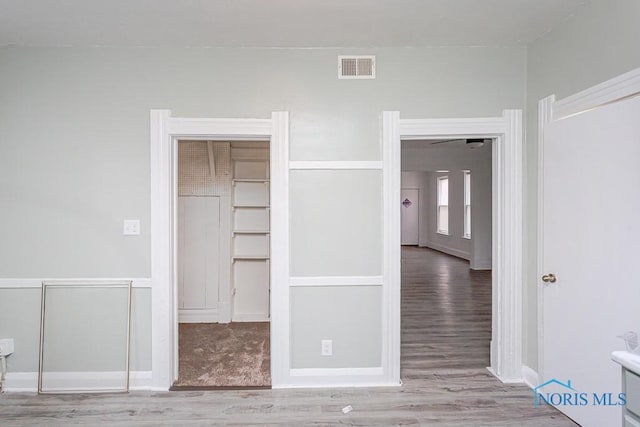 unfurnished bedroom featuring hardwood / wood-style floors and a closet