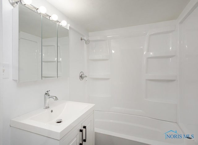 bathroom featuring vanity and shower / tub combination