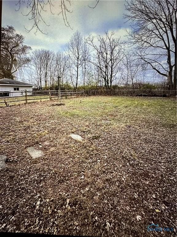 view of yard with a rural view