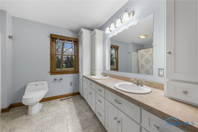 bathroom with vanity and toilet