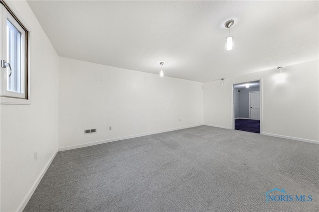 unfurnished room with carpet flooring