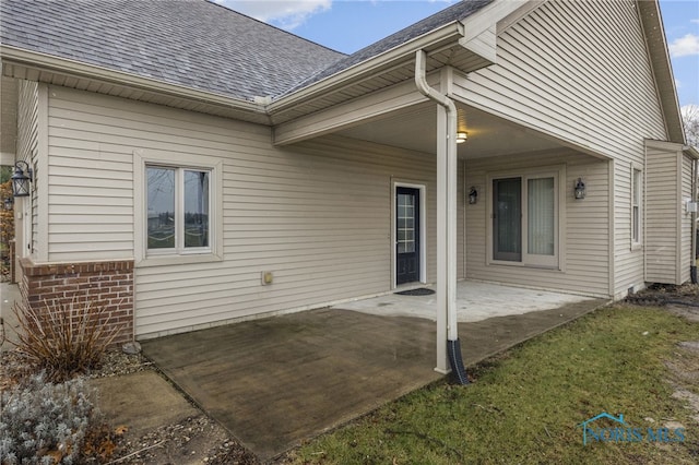 doorway to property with a patio area