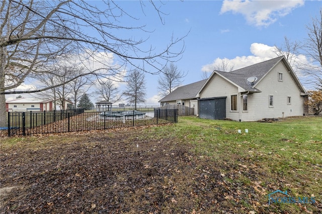 view of side of property with a lawn