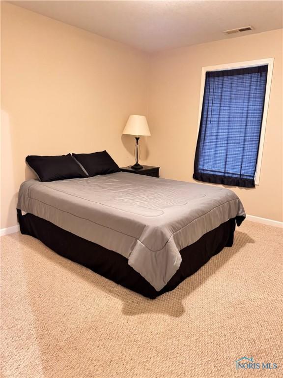 bedroom featuring carpet flooring