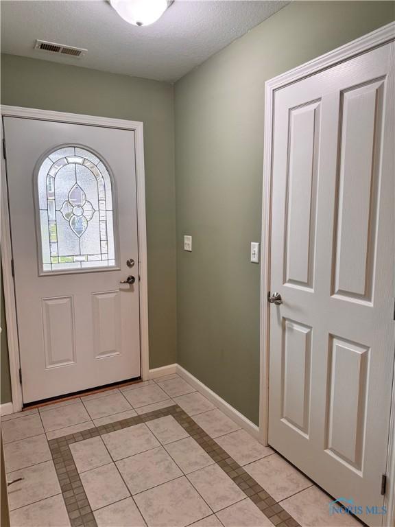 view of tiled entrance foyer