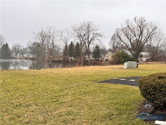 view of yard with a water view