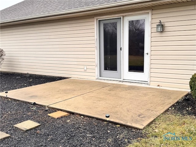 property entrance featuring a patio area