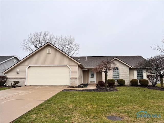 ranch-style house featuring a front lawn and a garage