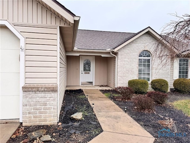 doorway to property featuring a garage