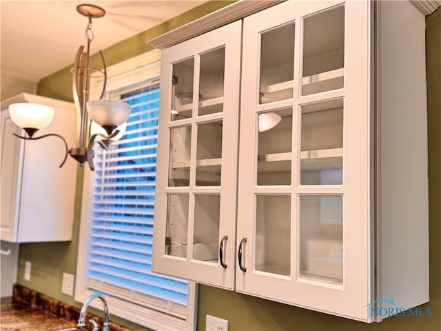 interior details with sink and white cabinets