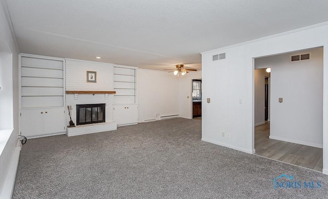 unfurnished living room featuring ceiling fan, a fireplace, carpet, and a baseboard radiator