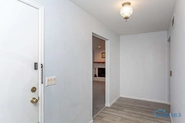 hallway featuring light wood-type flooring