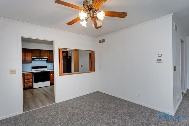 interior space with ceiling fan and ornamental molding