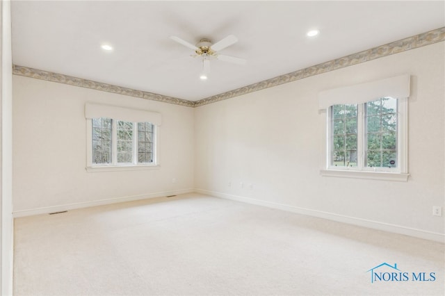 unfurnished room featuring carpet floors and ceiling fan