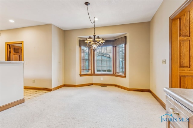 unfurnished room with light carpet and a chandelier